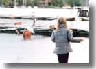 A young girl playing with the seagulls